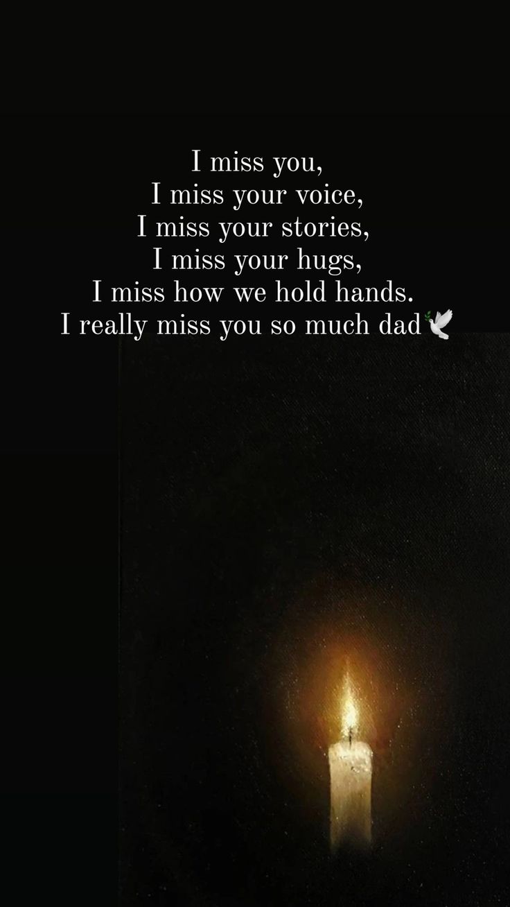 a lit candle with the words i miss you on it in front of a dark background