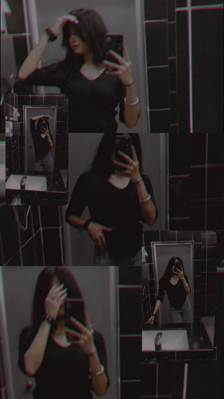 a woman taking a selfie in a bathroom mirror