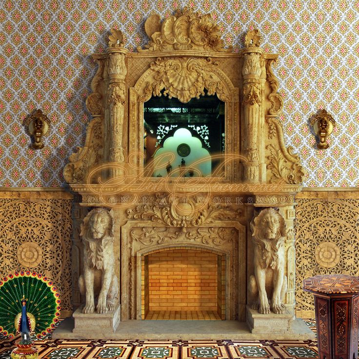 an ornate fireplace in the middle of a room