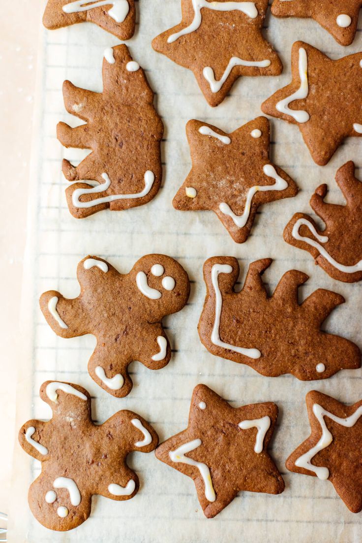 ginger cookies with icing on a baking sheet