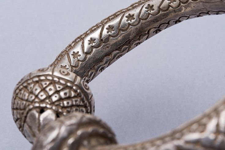 A quality 900 silver old Jhanjar bangle from India. A hollow embossed floral design 1940's tribal art piece. 8 inch inside dimension. 20cm 112grams Traditional Silver Carved Bangle, Traditional Silver Engraved Bangle, Traditional Engraved Silver Bangle, Antique Carved Bangle For Ceremonial Occasions, Silver Carved Ornate Bangle, Antique Carved Bangle For Ceremonial Events, Ornate Antique Silver Bangle With Intricate Design, Antique Carved Ceremonial Bangle, Silver Carved Bangle For Ceremonial Wear