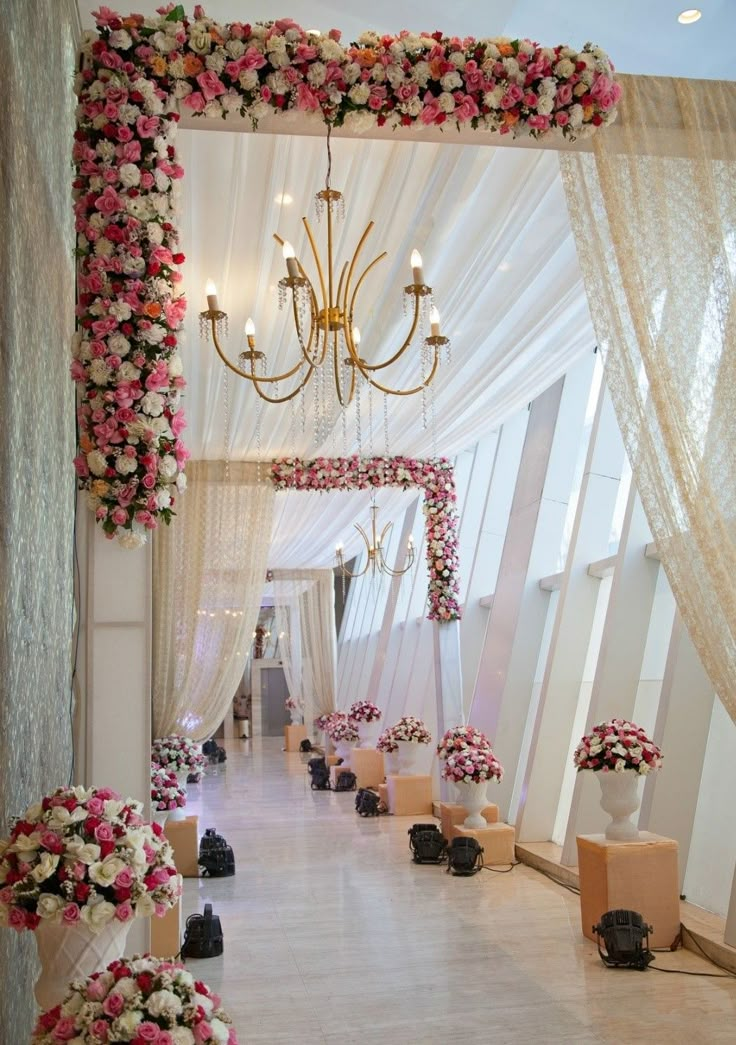 a room decorated with flowers and chandelier for a wedding or event video call