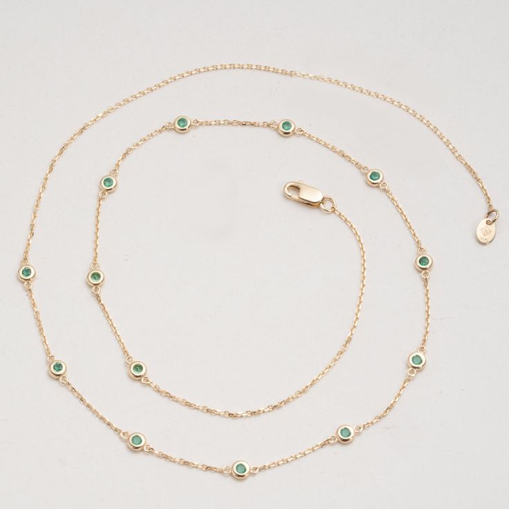 Gwen Timelessly beautiful, glistening Emeralds appear to float on your neck, with refined elegance. You will immediately feel like royalty! The classic station necklace will be your go-to, and truly never goes out of style as it just enhances your natural beauty. Also, it’s such an easy style to layer with other dainty necklaces. May’s birthstone, this stunning necklace will be the perfect gift for a woman of any age! - Handmade- Solid Gold- Natural Emerald- Bezel Size: 3 mm- Space Between the B Green Emerald Necklace With Adjustable Chain, Luxury Green Diamond Necklace With Gemstone, Luxury Green Gemstone Diamond Necklace, Luxury Green Diamond Gemstone Necklace, Luxury Green Diamond Necklace For May Birthstone, Green Emerald Diamond Necklace For May Birthstone, Green Diamond Necklace In Fine Jewelry Style, Fine Jewelry Green Diamond Gemstone Necklace, Green Gemstone Diamond Necklace In Fine Jewelry Style