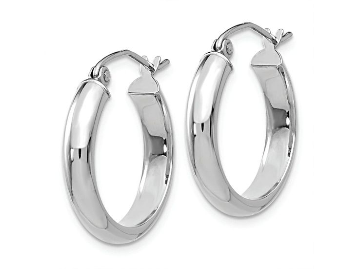 Rhodium over 14K white gold hoop earrings. Measure approximately 13/16"L x 1/8"W and have saddleback backings. Classic Small Hoop Sterling Silver Jewelry, Silver Oval Tarnish Resistant Hoop Earrings, Sterling Silver White Gold Hoop Earrings, Sterling Silver Rounded Jewelry With Polished Finish, Classic Sterling Silver Hoop Earrings For Formal Events, White Gold Sterling Silver Hoop Earrings, White Gold Round Hoop Earrings For Pierced Ears, White Gold Round Hoop Earrings, Fine Jewelry Oval Hoop Earrings With Polished Finish