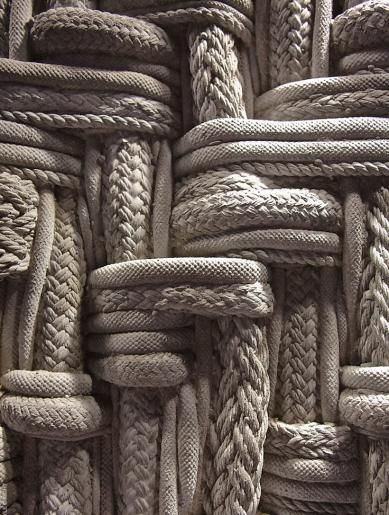 many ropes are stacked together to form a wall