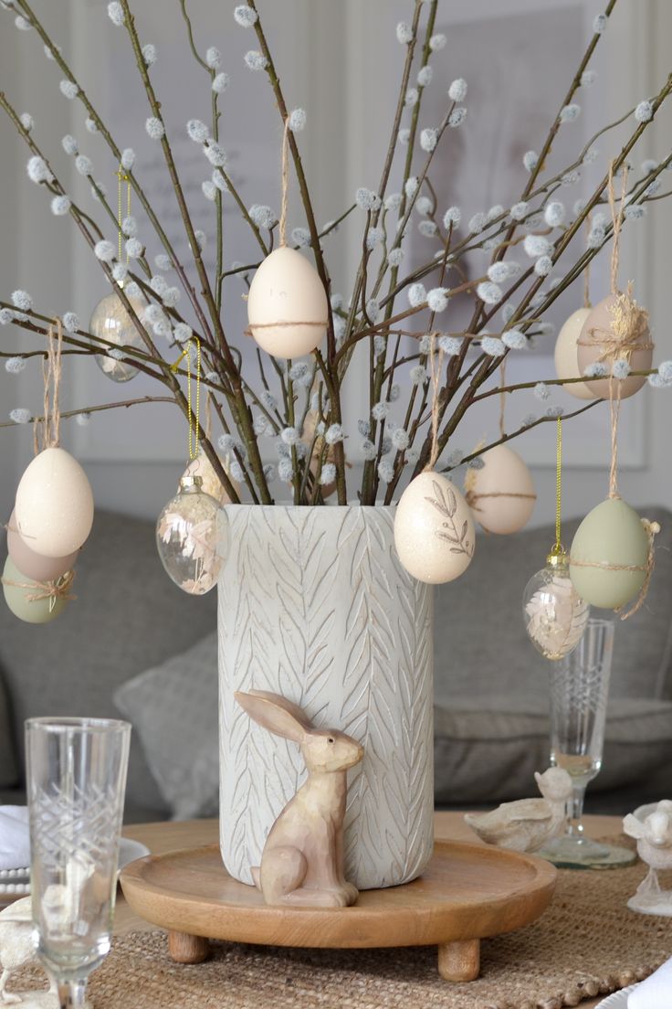 a vase filled with ornaments sitting on top of a table