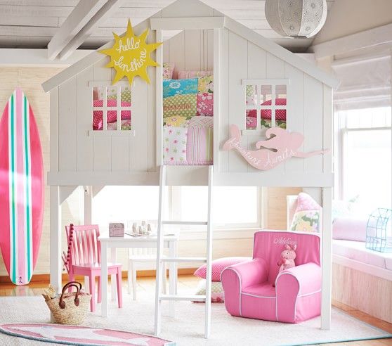 a child's bedroom with a pink surfboard on the wall and bunk bed