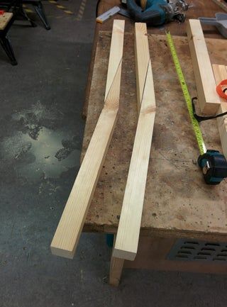 several pieces of wood sitting on top of a table