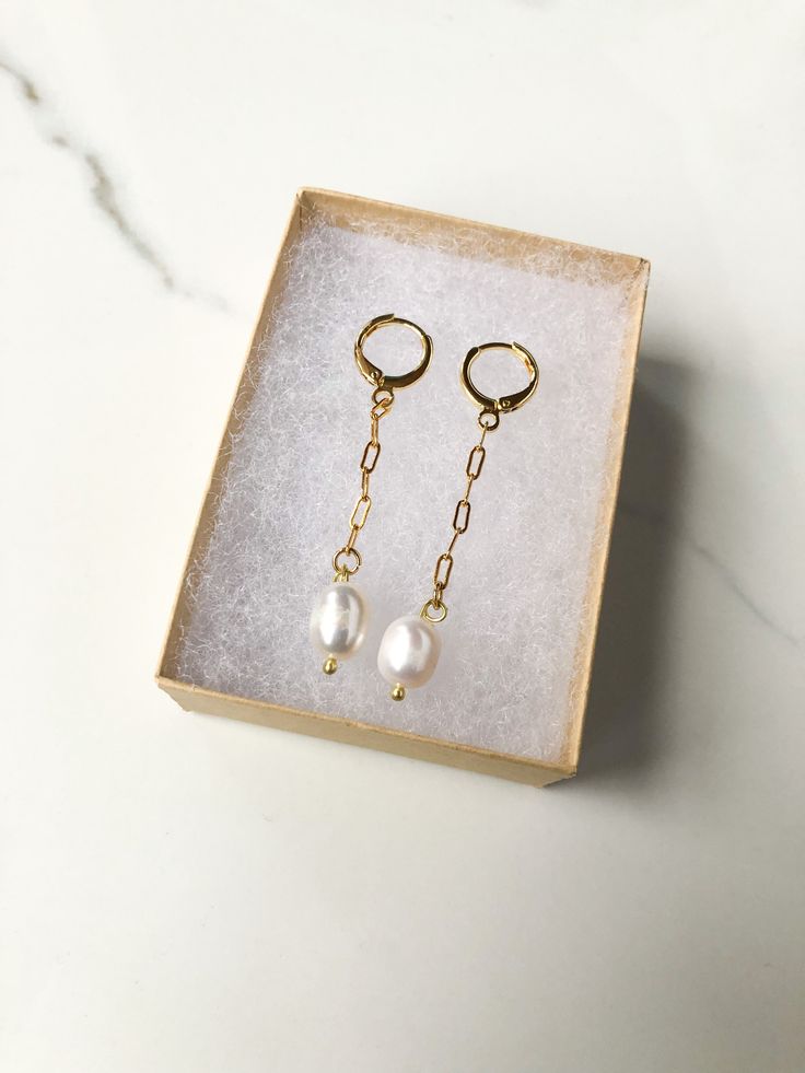 These earrings are two inches in length. Hypoallergenic and nickel free.