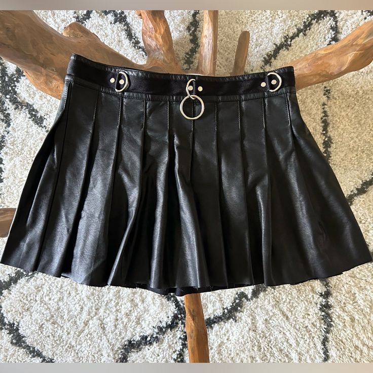 Current Mood Pleated Pleather Punk Skirt. Brand New With Tags Amazing Black Alternative Skirt. The Top Part Looks Like It Has A Belt. Has D Ring Design And In The Middle Has An Oring. It’s Such A Fantastic Piece For An Alternative Closet. Size Is Large. Waist 29 “Inches. Length 13.5” Inches #Currentmood #Goth #Punk #Skirt #Alternative Leather Pleather Faux Black Rings Belt Oring Dring New Nwt Gift Rock Style Skirt For Concert, Black Grunge Skirt For Club, Rock Style Mini Skirt For Fall, Punk Style Pleated Skirt For Night Out, Black Rock Skirt For Concert, Rock Style Mini Skirt For Concert, Rock Style Mini Skirt For Fall Party, Grunge Skirt For Night Out, Black Rock Style Skirt For Concert