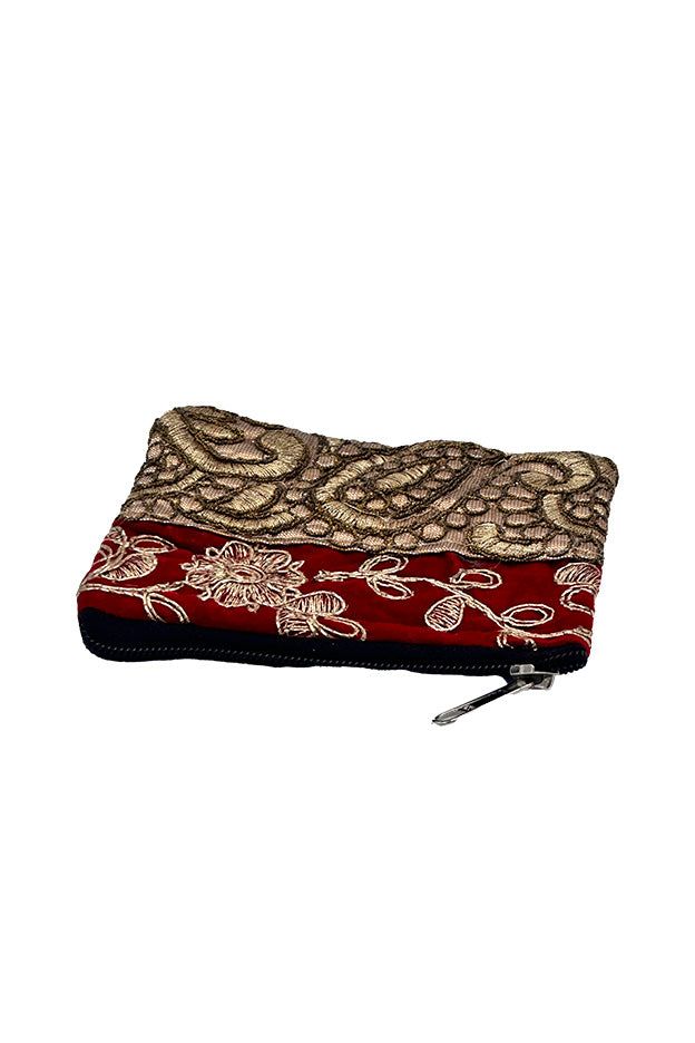 Elevate your accessory collection with this exquisite coin pouch, showcasing the intricate art of Zari embroidery. This handmade pouch features a striking combination of multiple colors and gold threads, meticulously woven into floral and paisley patterns. Perfect for the modern bohemian chic, this Banjara small pouch offers both style and functionality. Ideal for carrying coins and small essentials, it adds a touch of traditional elegance to your everyday look. Keywords: bohemian chic accessori Bohemian Gold Festive Pouch, Bohemian Gold Pouch For Festivals, Festive Gold Bohemian Pouch, Festive Bohemian Gold Pouch, Gold Bohemian Pouch For Festivals, Bohemian Style Festive Pouch As Gift, Bohemian Pouch As Festive Gift, Bohemian Pouch With Zari Work For Festivals, Festive Bohemian Pouch As Gift