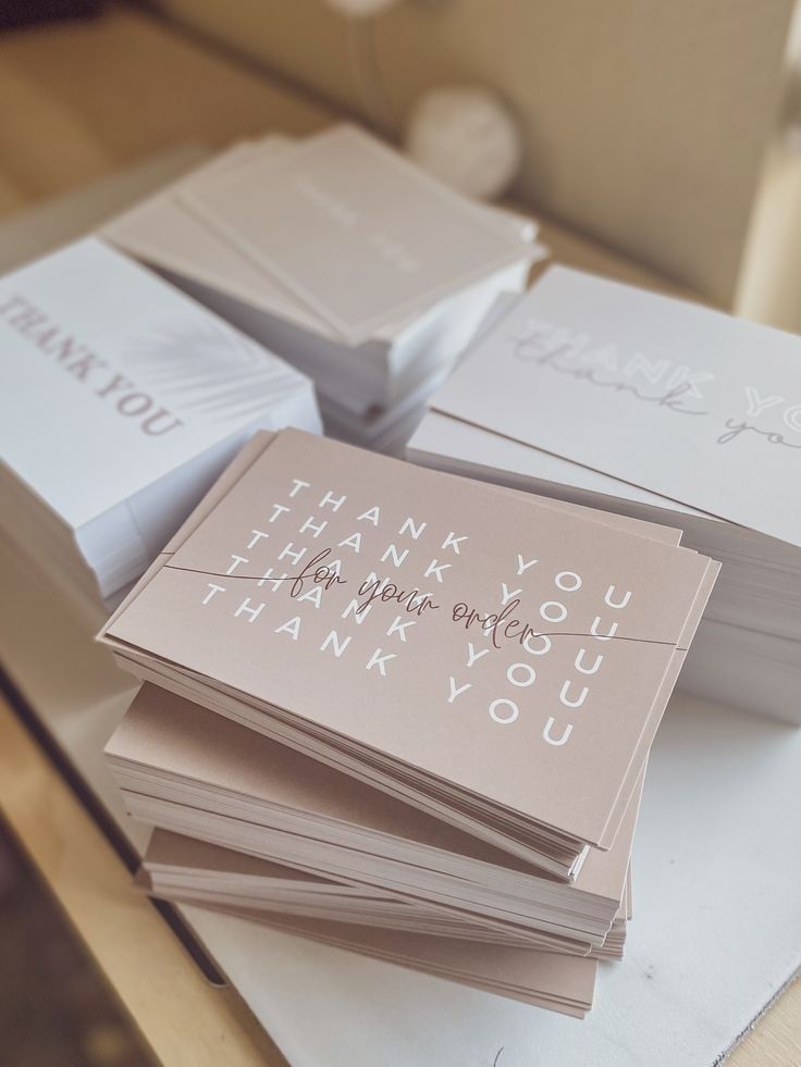 several thank you cards are stacked on top of each other with the words thank you written on them