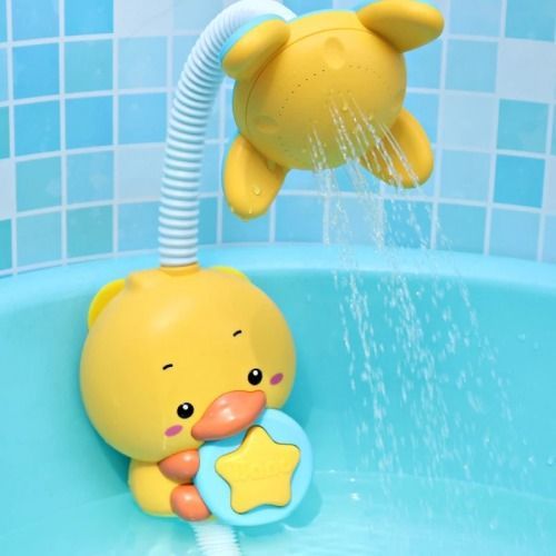 a yellow ducky bath toy in a blue tub with water coming out of the faucet