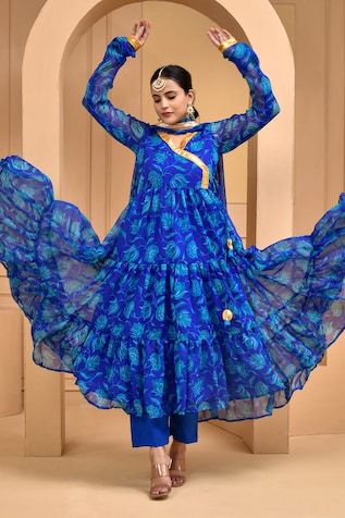 Blue tiered anarkali with all over floral bloom prints and gota patti work. Paired with a pant and dupatta with floral prints and gota patti border. - Aza Fashions Blue Floral Chanderi Kurta, Unstitched Blue Floral Traditional Wear, Unstitched Blue Floral Print Traditional Wear, Blue Floral Print Unstitched Traditional Wear, Blue Floral Print Sharara For Eid, Blue Floral Print Dupatta For Navratri, Unstitched Blue Floral Print Sharara, Blue Floral Print Anarkali Set For Navratri, Blue Floral Print Unstitched Sharara