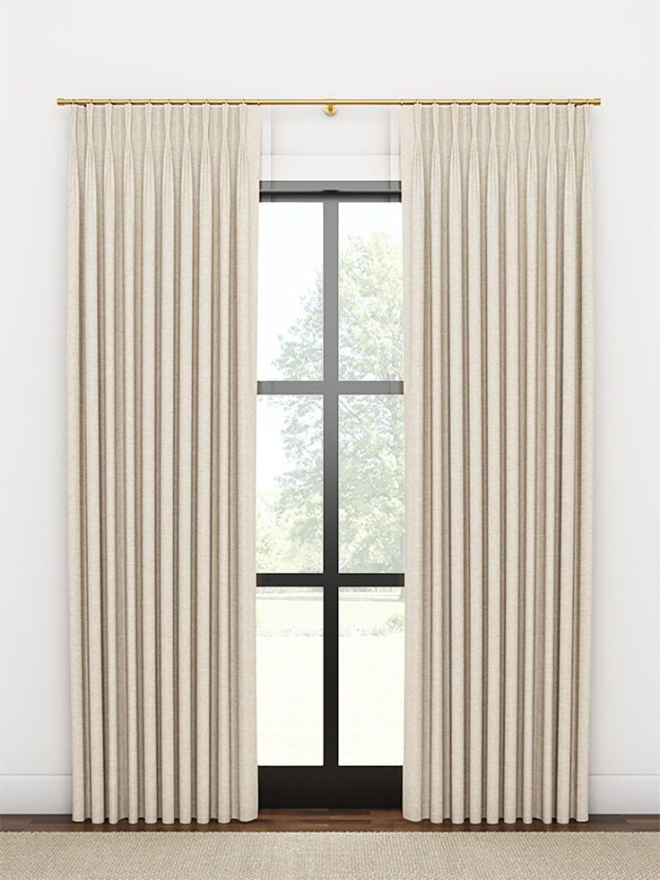 an open window with white curtains in front of it and a beige rug on the floor