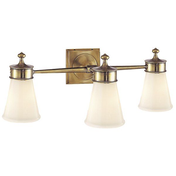 The Visual Comfort Signature, formerly known as Visual Comfort, Siena Vanity Light has a truly classical presence with opaque glass against shiny metalwork. Three tapered shades illuminate the space, creating a lit atmosphere with attention to iconic style. Color: White. Finish: Hand-Rubbed Antique Brass. Sharon Taylor, Pool Bath, Lighting Bathroom, Dream Bath, Glass Wall Lights, 2024 Design, Bath Vanity Lighting, Bath Light, Basement Bathroom