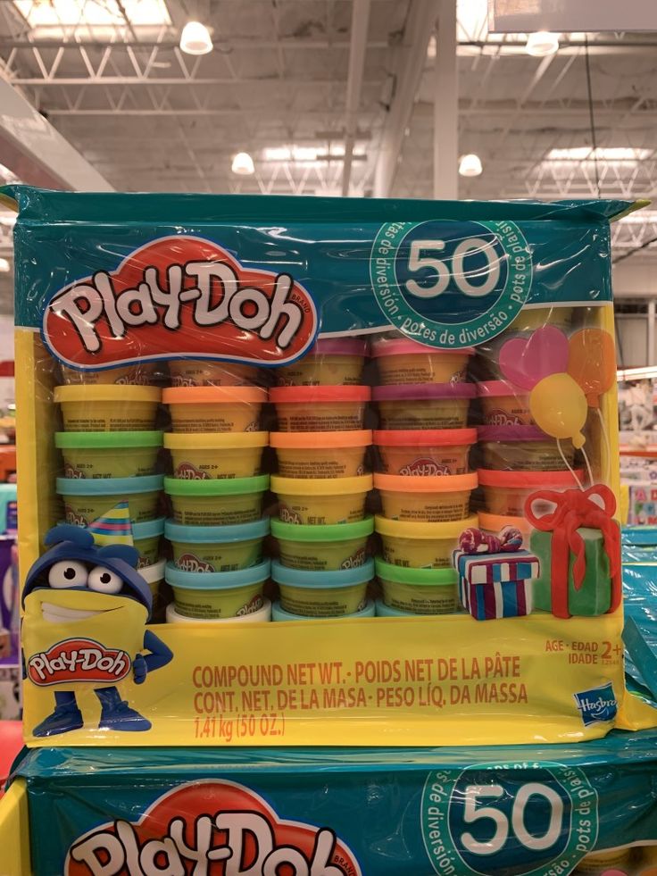 play - doh cups are stacked on display in a toy store for $ 50