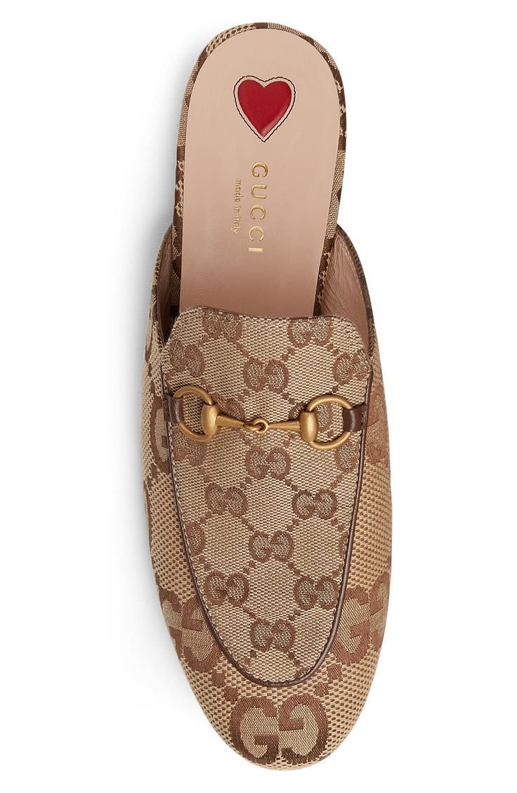 Pre-order this style today! Add to Shopping Bag to view approximate ship date. You'll be charged only when your item ships.Exploded GG monograms maximize the heritage style of this signature loafer mule with golden horsebit hardware and a stitched heart at the heel. Textile upper/leather lining and sole Made in Italy Women's Designer Shoes Gucci Princetown, Monogram Outfit, Heritage Fashion, Loafer Mules, Footwear Design Women, Gucci Mules, Mule, Designer Shoes, Designing Women