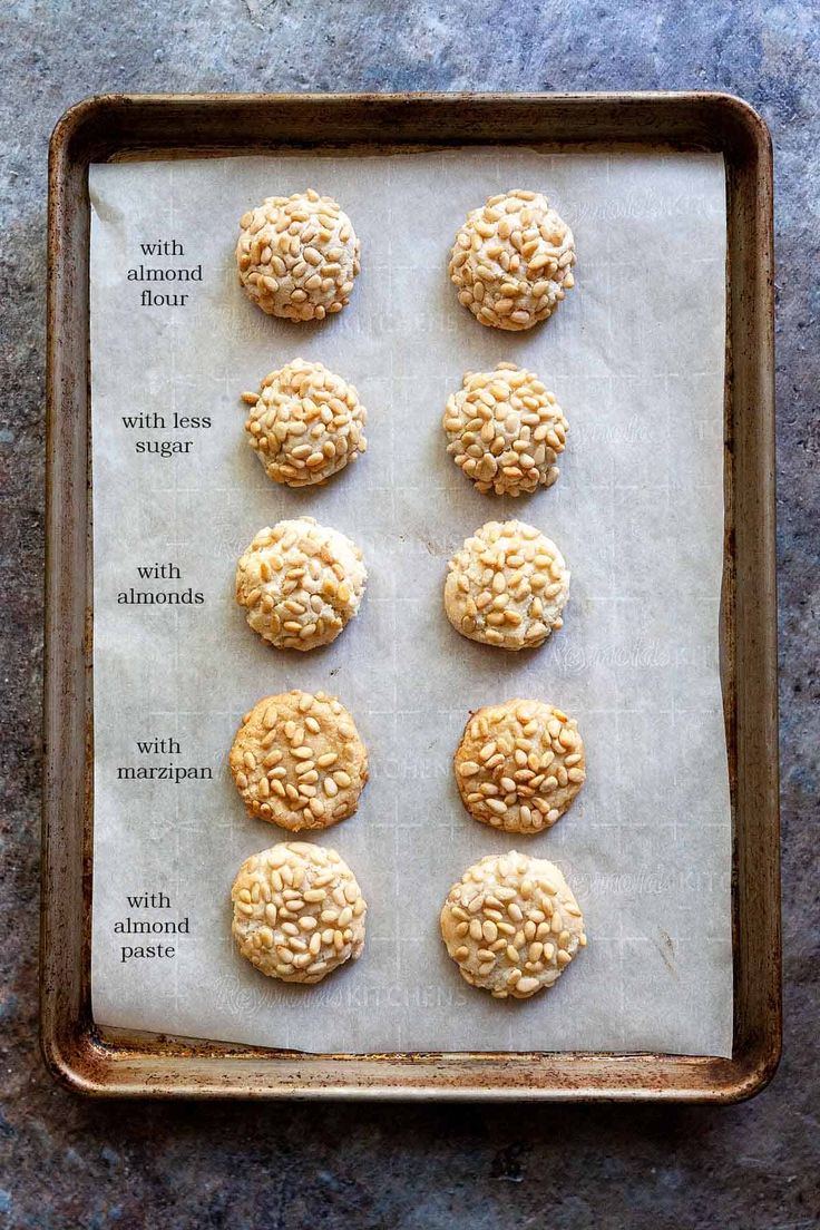 six cookies on a baking sheet ready to go into the oven with oatmeal toppings