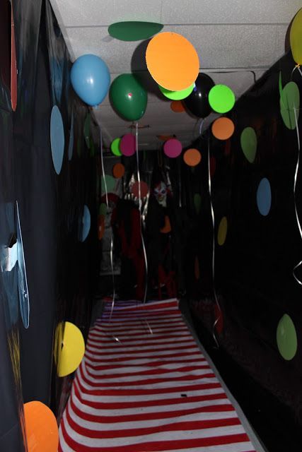 a hallway decorated with balloons and streamers