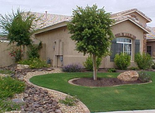 a house with landscaping in front of it