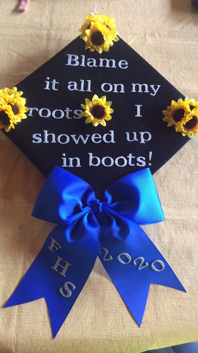 a blue graduation cap with sunflowers on it and the words blame it all on my roots i showed up in boots