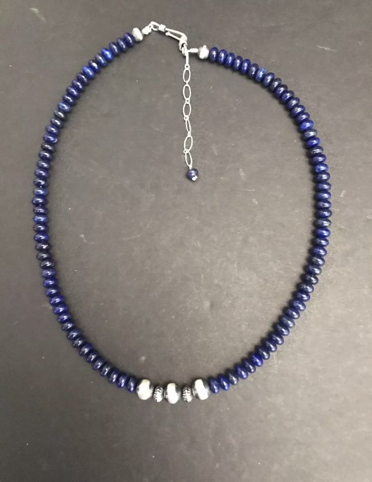 sterling shaded lapis bead necklace. The necklace measures 16 inches Lapis Lazuli Rondelle Gemstone Beads Jewelry, Blue Sterling Silver Necklace With Spacer Beads, Sterling Silver Rondelle Necklace With Polished Beads, Silver Jewelry With Faceted Beads Made Of Lapis Lazuli, Silver Jewelry With Faceted Beads In Lapis Lazuli, Sapphire Lapis Lazuli Beaded Necklace, Adjustable Lapis Lazuli Necklace With Faceted Beads, Single Strand Lapis Lazuli Round Bead Necklace, Single Strand Lapis Lazuli Bead Necklace