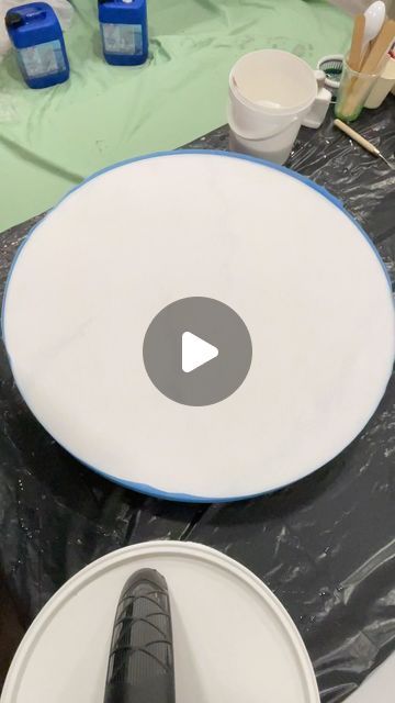 a white plate sitting on top of a table covered in plastic