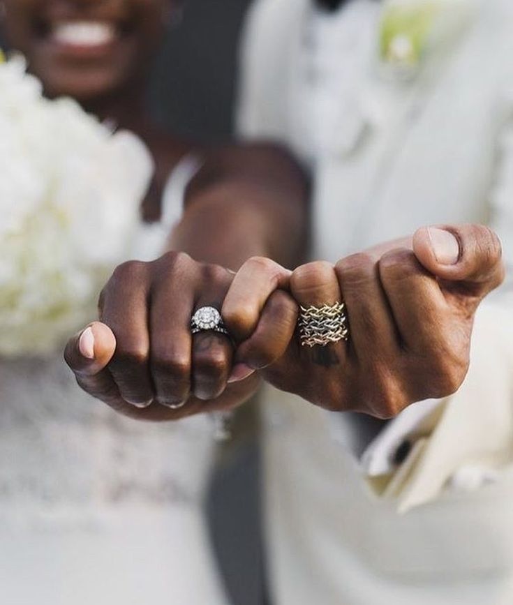 two people holding hands with rings on their fingers and the text instagram above them