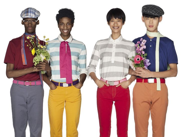 three young men standing next to each other with flowers in their hands and wearing colorful pants