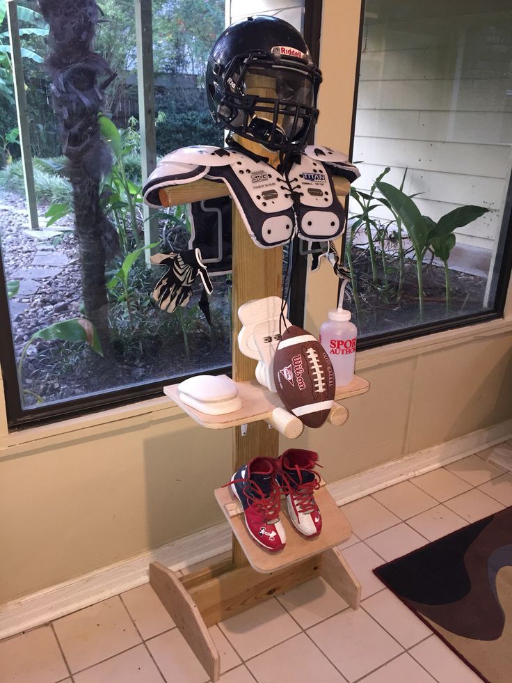 there is a football helmet and shoes on display