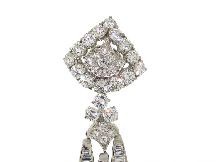 An absolute delight in diamonds, these sumptuous earrings are sure to become your go-to gala gems! Sexy and sparkling, these delightful dangles feature structured diamond tops suspending long sweeps of baguette, prong set round and pave diamonds that connect at the gently pointed bottoms. Glamorous Brilliant Cut Diamond Earrings, Glamorous Brilliant Cut Diamond Earrings For Evening, Glamorous Diamond Dangle Earrings, Diamond Chandelier Earrings With Prong Setting For Party, Glamorous Dangle Diamond Earrings, Evening Diamond Cut Chandelier Earrings, Luxury Diamond Chandelier Earrings For Evening, Diamond Cut Chandelier Earrings For Evening, Evening Bridal Dangle Diamond Earrings