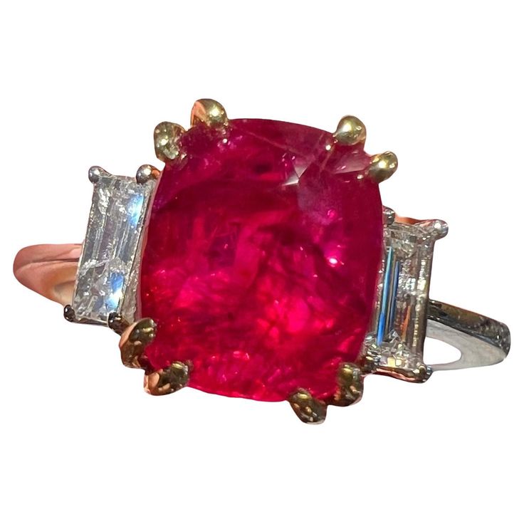 Superb natural ruby of 3.17 carat set on a yellow gold bezel, the body of the ring being in white 18 carat gold, the ruby is surrounded by baguette diamond for 0.42 carat in total total weight of the ring: 4.20 grams finger size: 54 free resize Baguette Diamond, Natural Ruby, Jewelry Rings Engagement, Ring Verlobung, Gold Rings, Ruby, Jewelry Rings, Diamonds, Yellow Gold