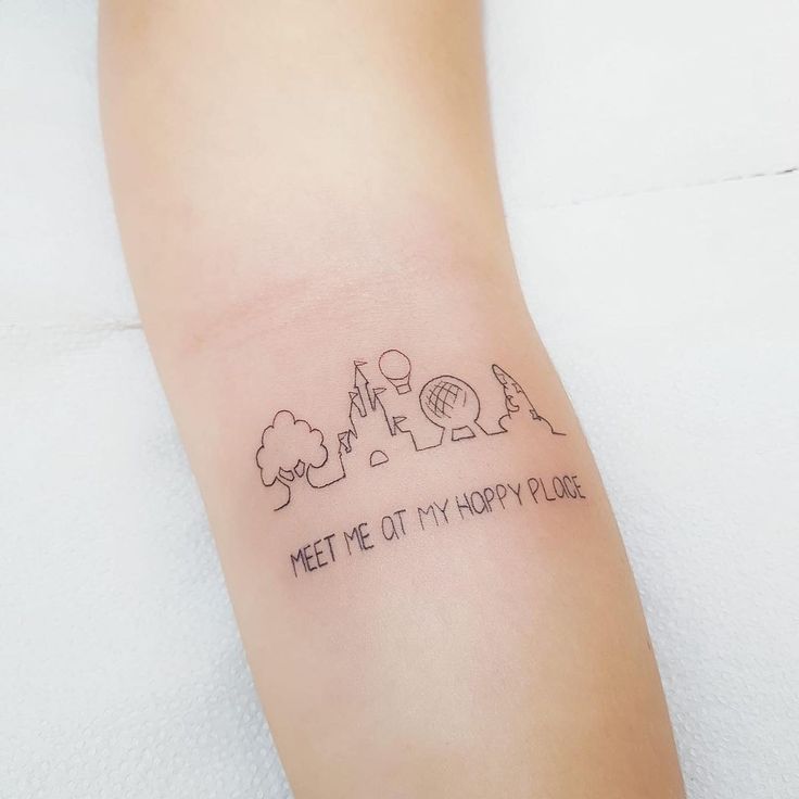 a small wrist tattoo with the words meet me at my happy place