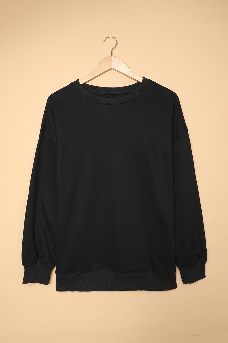 Black Oversized Solid Drop Shoulder Sweatshirt Oversized Plain T-shirt For Fall, Oversized Black T-shirt With Ribbed Cuffs, Oversized Black Plain Top, Black Crew Neck Sweater Solid Color, Oversized Black Top, Oversized T-shirt For Fall, Oversized Solid Color T-shirt For Fall, Oversized Basic Plain Sweatshirt, Black T-shirt With Ribbed Cuffs For Fall