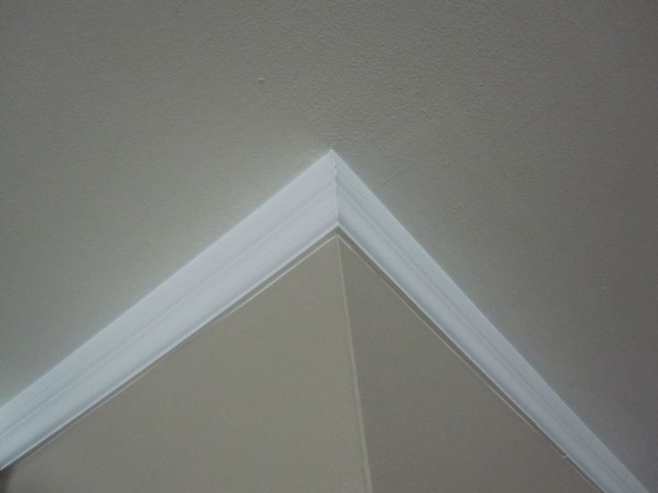 the corner of a room with white trim