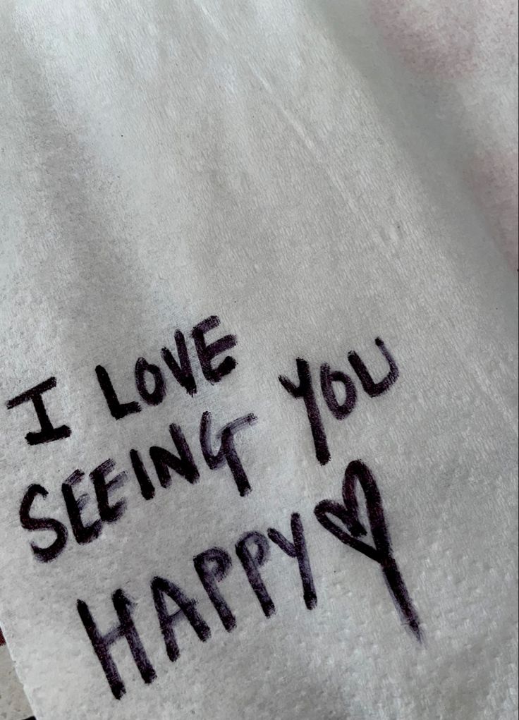 i love seeing you happy written on a white towel with black writing in cursive font