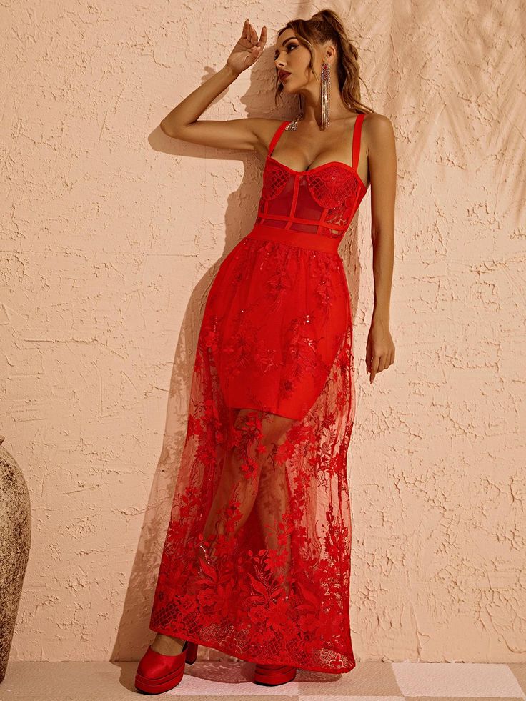 Without a doubt the most incredible gown you've ever laid eyes on. Arrive at your event in style, you'll be looking drop dead gorgeous & turning heads in this stunning gown. Red fabric is a must for making a statement. Amirah Maxi Dress In Red is covered in floral embellishments with scattered sequins throughout, a sheer bodice & skirt & sewn in mini skirt lining. An unregrettable & unforgettable choice for your special event. Material: Bandage (90% Rayon, 9% Nylon, 1% Elastane) Invisible zipper Red Festive Evening Gown, Red Party Dress With Sheer Bodice, Red Dresses With Sheer Bodice For Party, Red Dress With Sheer Bodice For Parties, Glamorous Red Ball Gown, Red Ball Gown Dresses For Red Carpet, Red Prom Evening Dress With Sheer Bodice, Red Dresses With Sheer Fitted Bodice, Red Wedding Dress With Sheer Bodice