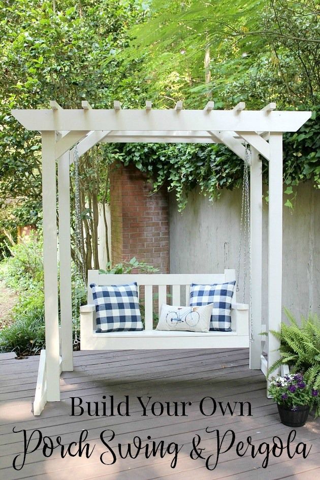 a white bench sitting on top of a wooden deck