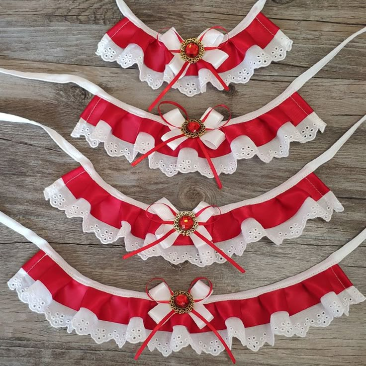 three red and white garters with bows on them