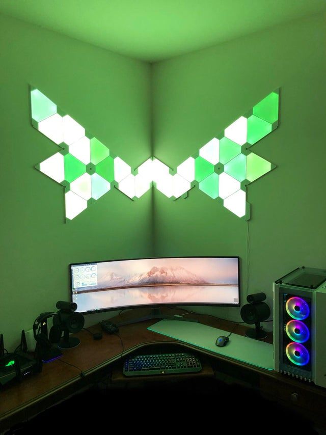 a computer monitor sitting on top of a wooden desk