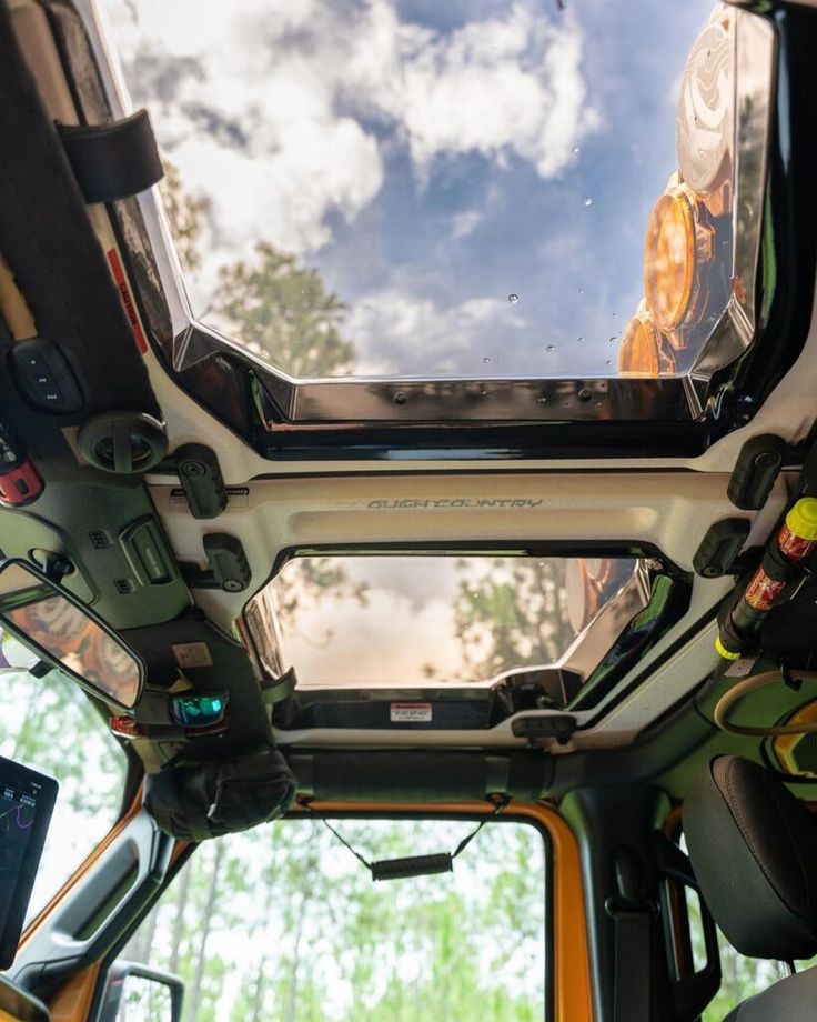 the interior of a vehicle with its sunroof open