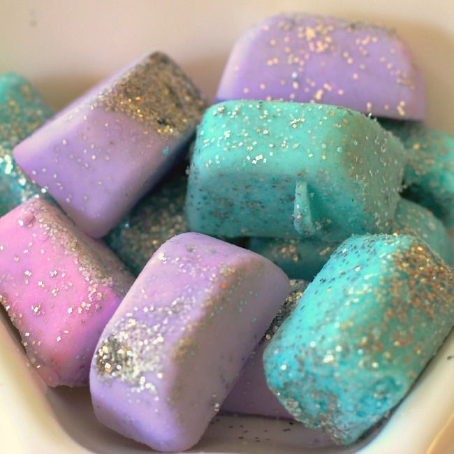 colorful marshmallows in a white bowl with gold flecks on them