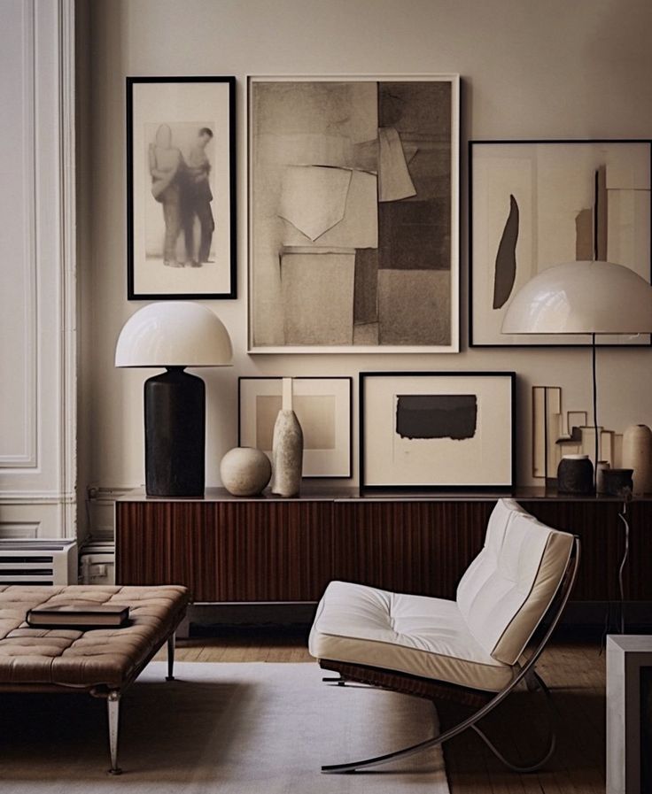 a living room filled with furniture and pictures on the wall