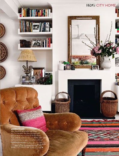 a living room filled with furniture and a fire place