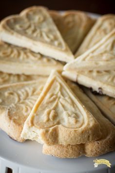 a white plate topped with slices of cake