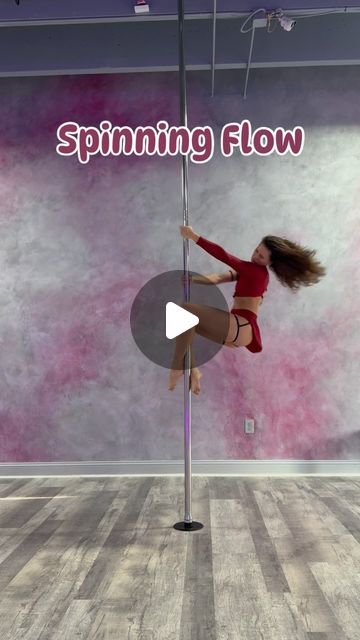 a woman is doing tricks on a pole