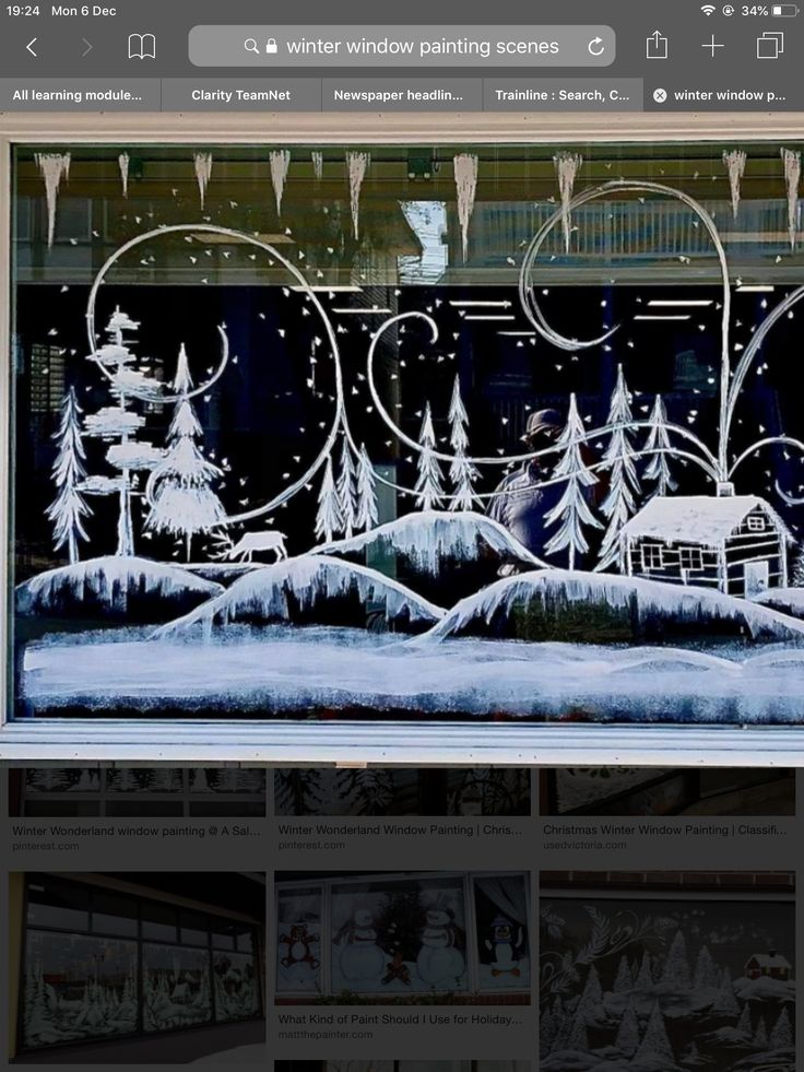 the window is decorated with snow and trees