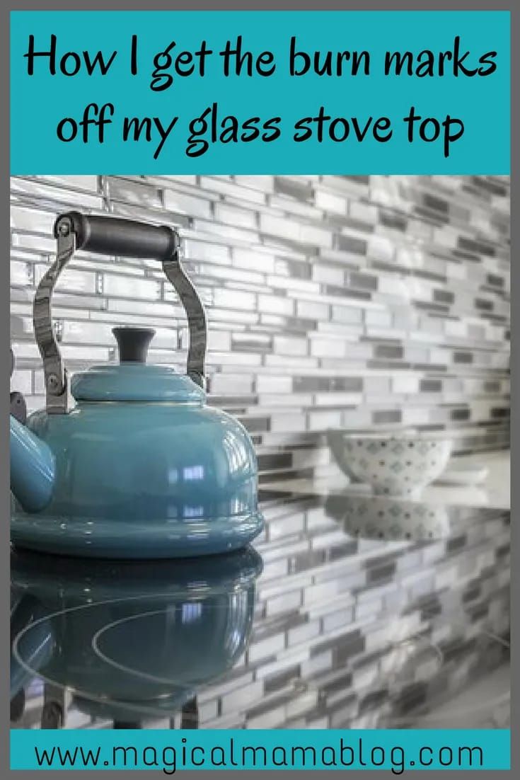 a blue tea kettle sitting on top of a glass stovetop next to a white bowl