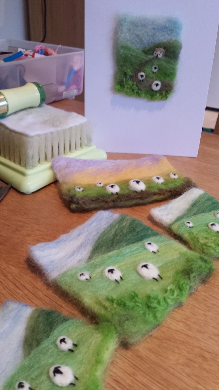 some sheep are on the table and one is green